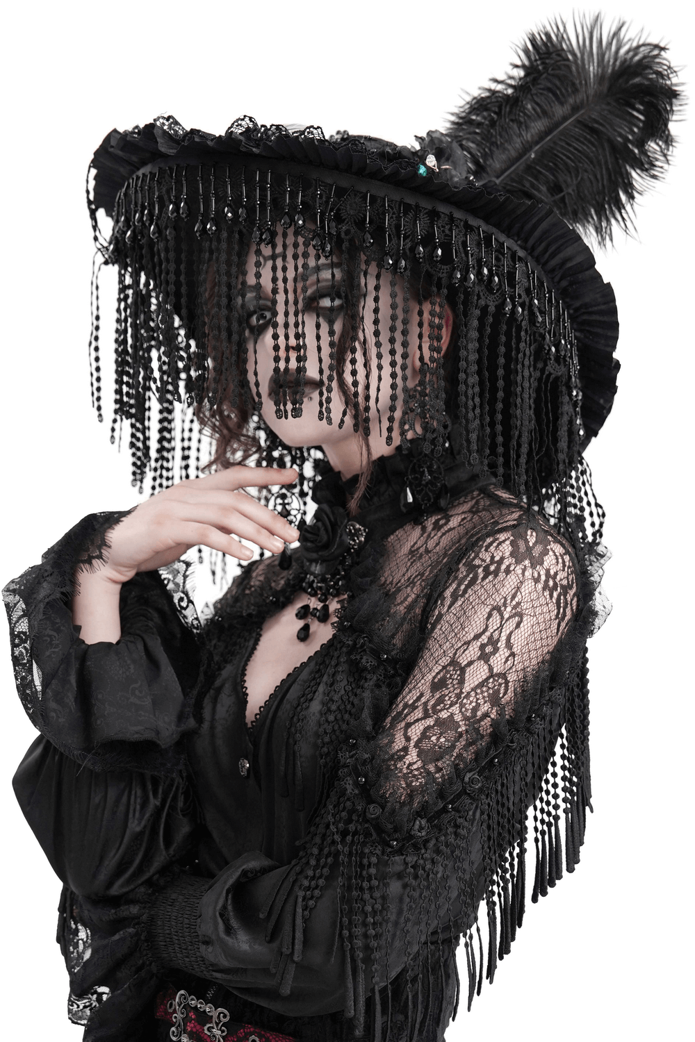 Elegant black lace Victorian Gothic hat with feathers and beaded fringe, worn by a mysterious woman in dramatic attire.