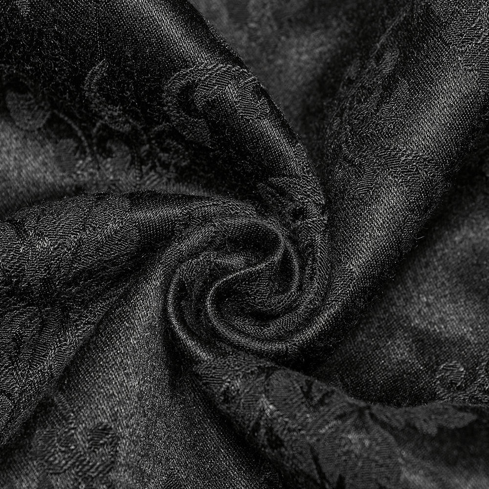 Close-up of luxurious black jacquard fabric with intricate gothic lace patterns, perfect for a Victorian waistcoat.