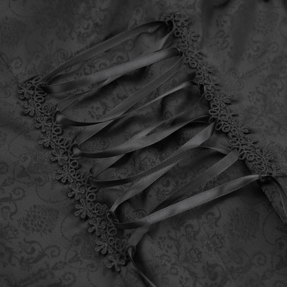 Intricate lace-up detail with floral accents on a black Victorian gothic blouse, showcasing elegance and sophistication.