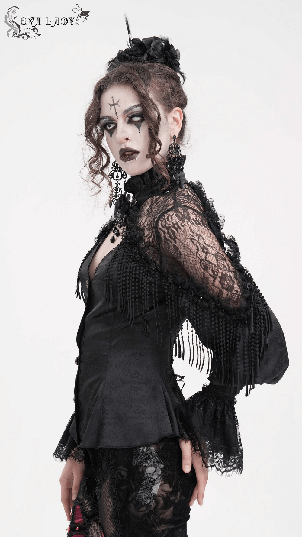 Elegant Victorian Gothic blouse with lace details and beaded tassels, showcasing a dramatic silhouette and unique accessories.