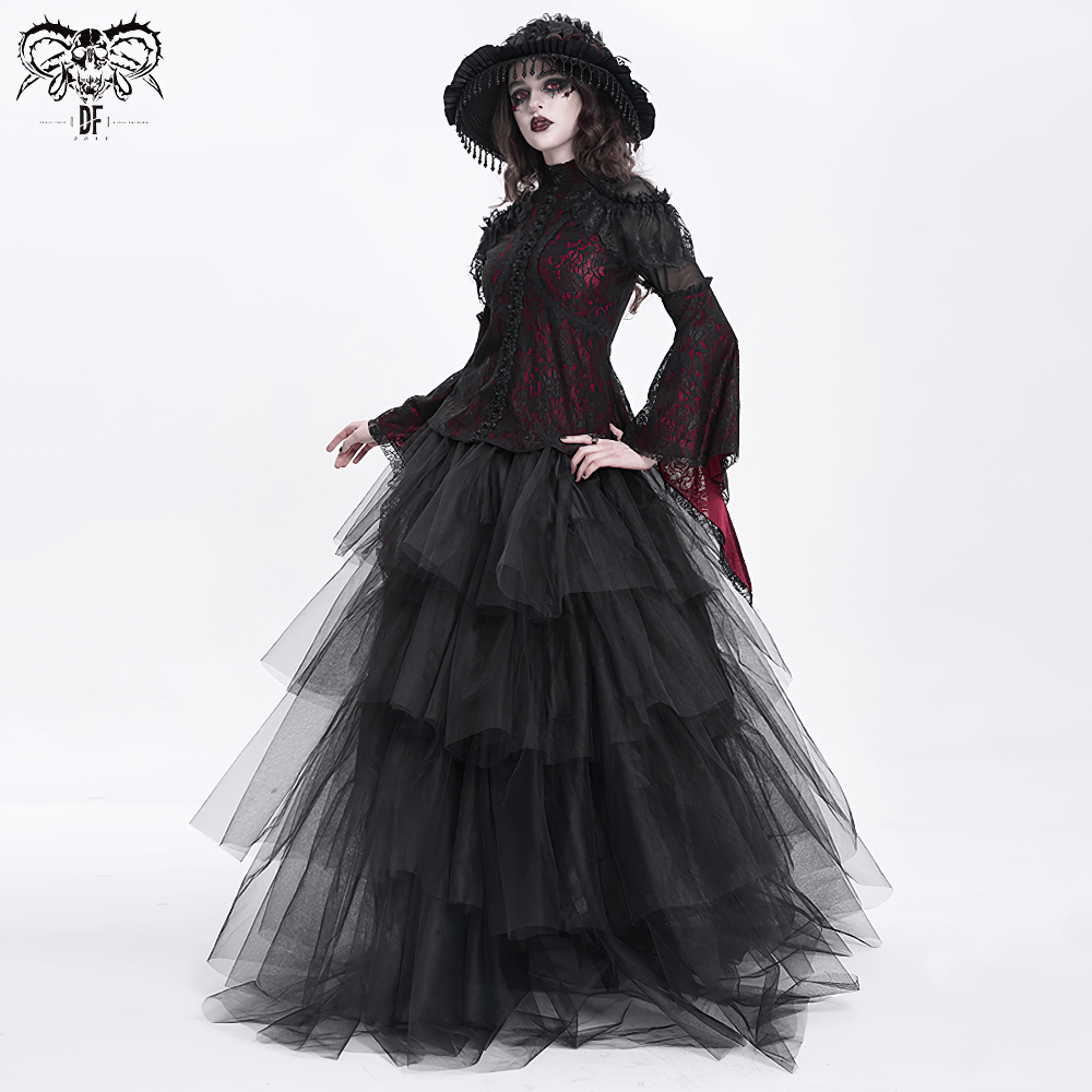 Elegant woman in a Victorian gothic lace blouse and layered black tulle skirt, showcasing romantic gothic fashion.