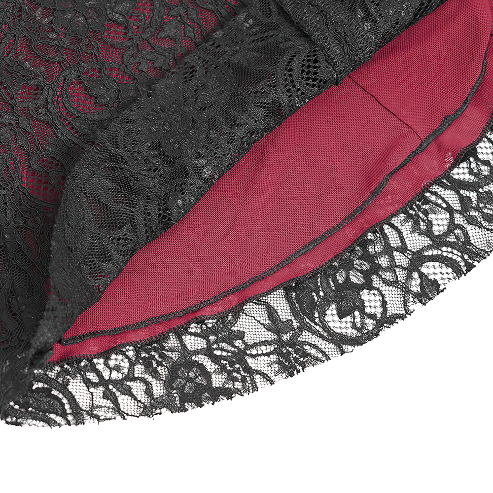 Close-up of Victorian Gothic blouse showcasing intricate black lace overlay and rich red lining detail.