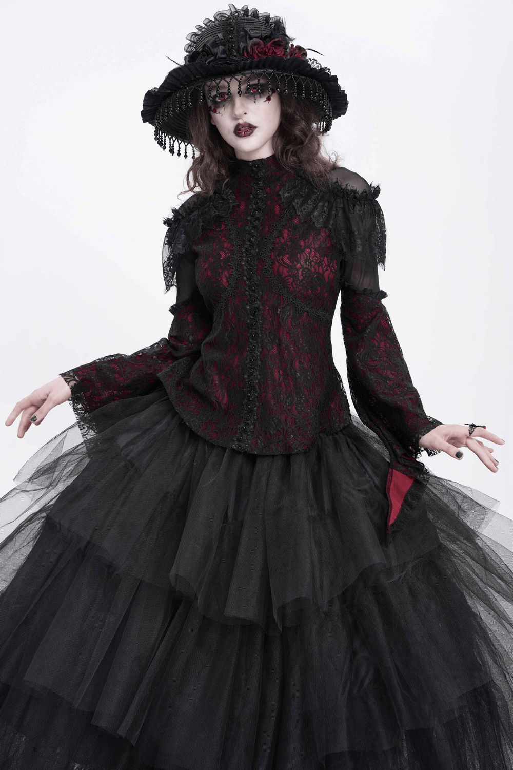 Victorian Gothic lace blouse with cold shoulder sleeves, sheer details, and flowing tulle skirt in a dramatic black ensemble.