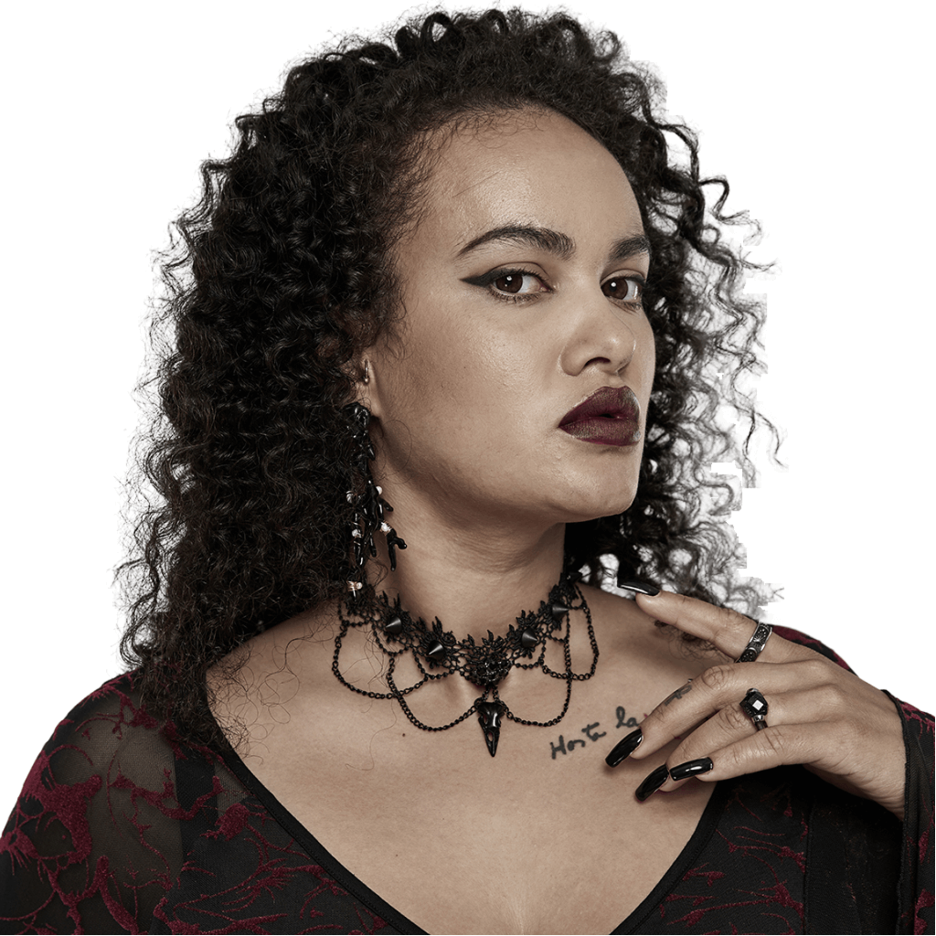 Elegant model wearing a Victorian Gothic lace choker with chains and a bird skull pendant, exuding dark elegance.