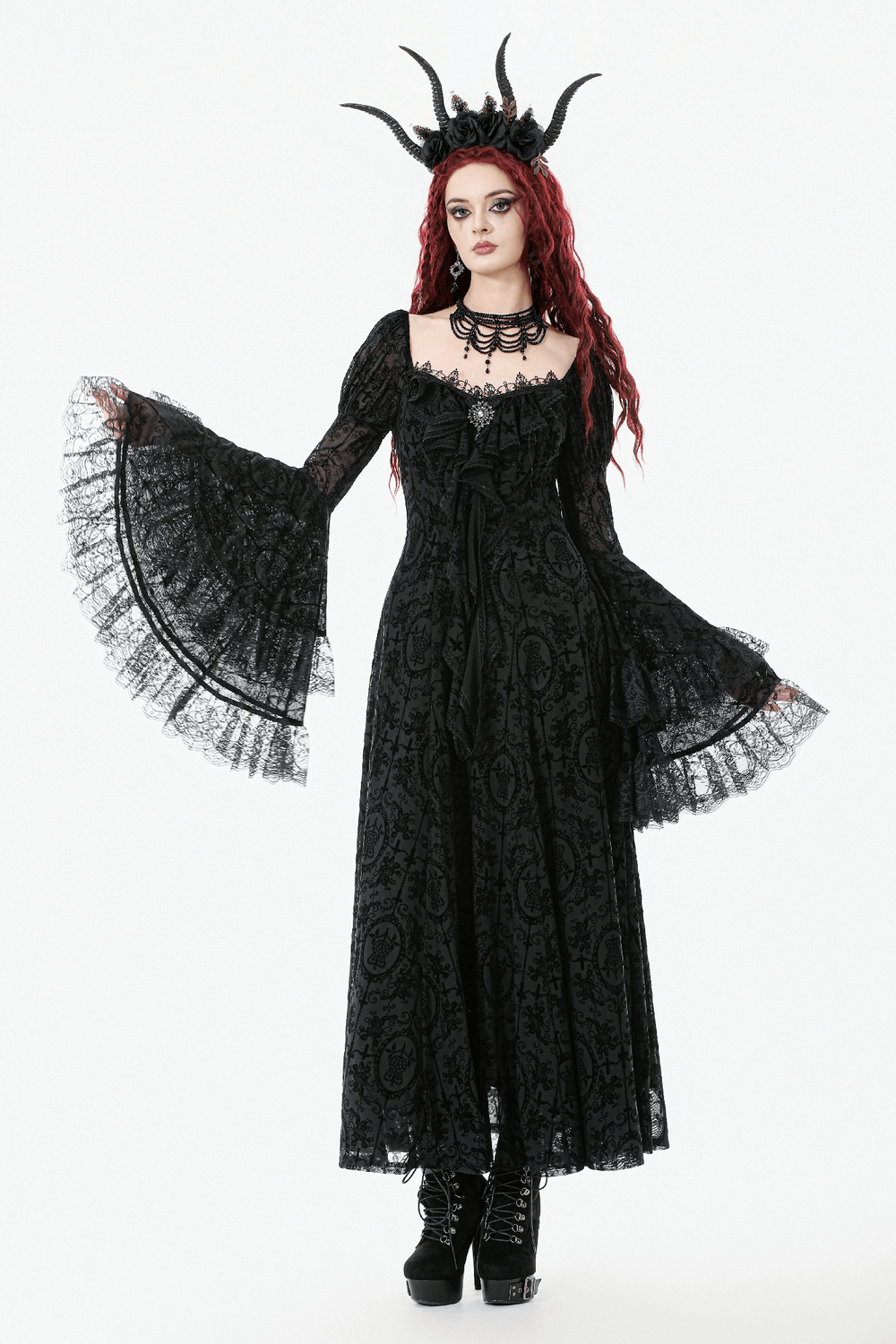 Victorian Gothic Lace Maxi Dress with Bell Sleeves on a model with red hair and ornate accessories.