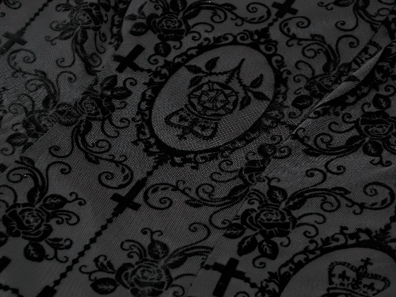 Victorian Gothic Lace Maxi Dress with Bell Sleeves detailed black fabric featuring intricate lace and rose patterns.