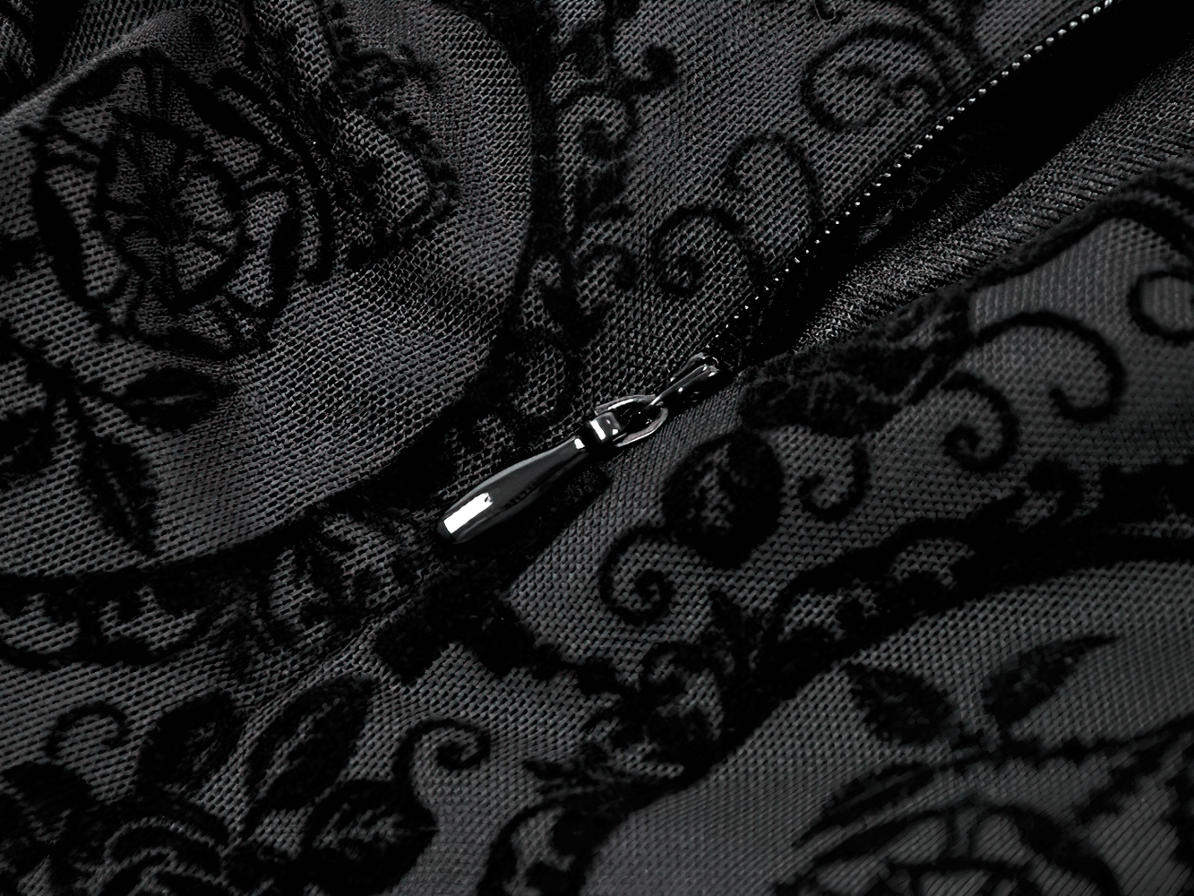 Close-up of the zipper detail on the Victorian Gothic Lace Maxi Dress with Bell Sleeves, showcasing intricate lace design.