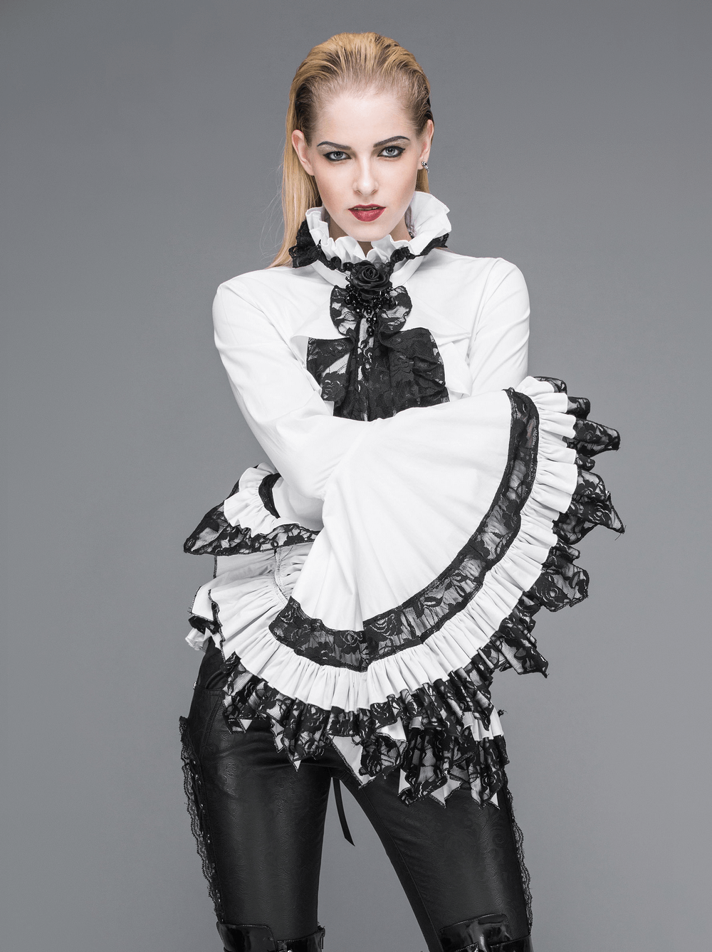 Victorian gothic lace ruffle blouse with black tie neck, featuring dramatic sleeves and stylish lace details.