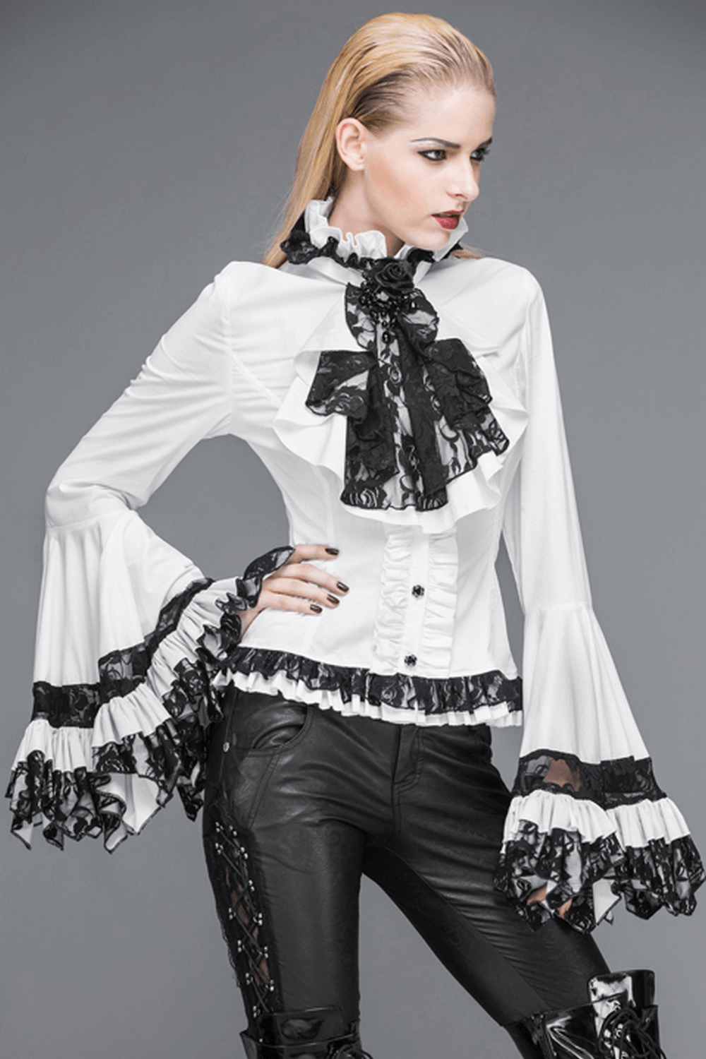 Victorian Gothic lace ruffle blouse with black tie neck, featuring dramatic sleeves and intricate detailing.