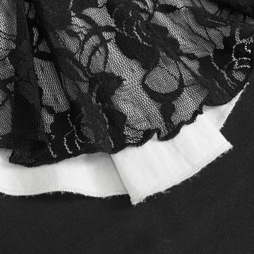 Close-up of Victorian Gothic lace ruffle blouse showing intricate black lace and white fabric details.