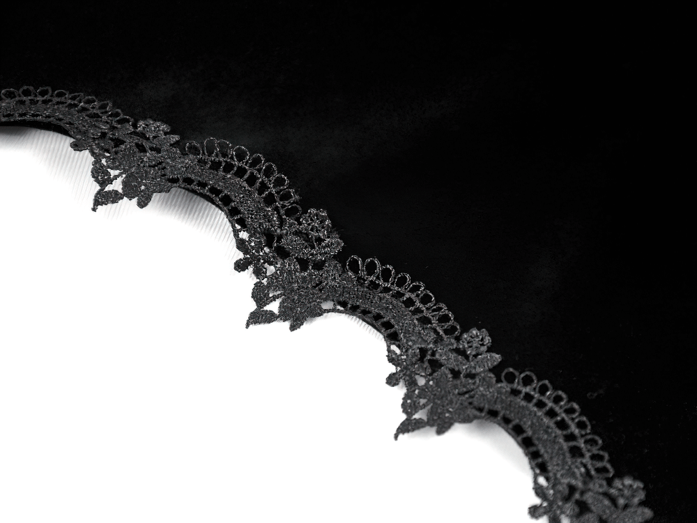 Close-up of intricate lace detailing on the Victorian Gothic Lace Shrug with Velvet Bell Sleeves.