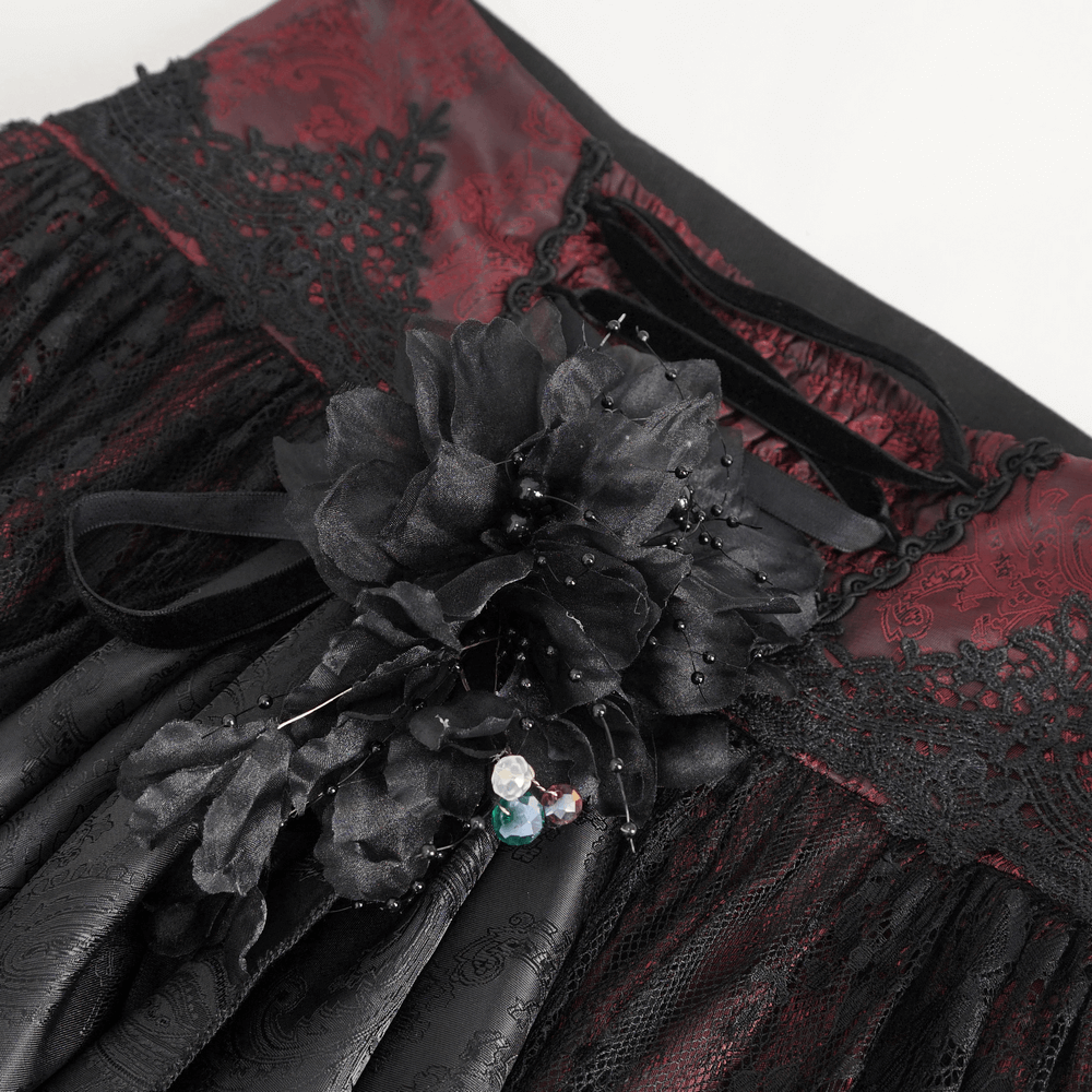 Intricate black and red Gothic lace skirt featuring ruffled layers and floral embellishments.