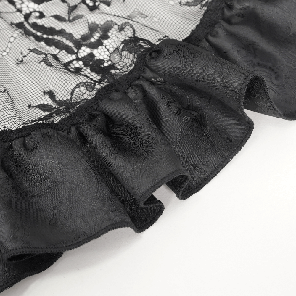 Close-up of ruffled black lace detail from a Victorian Gothic skirt, showcasing its elegant design and intricate texture.