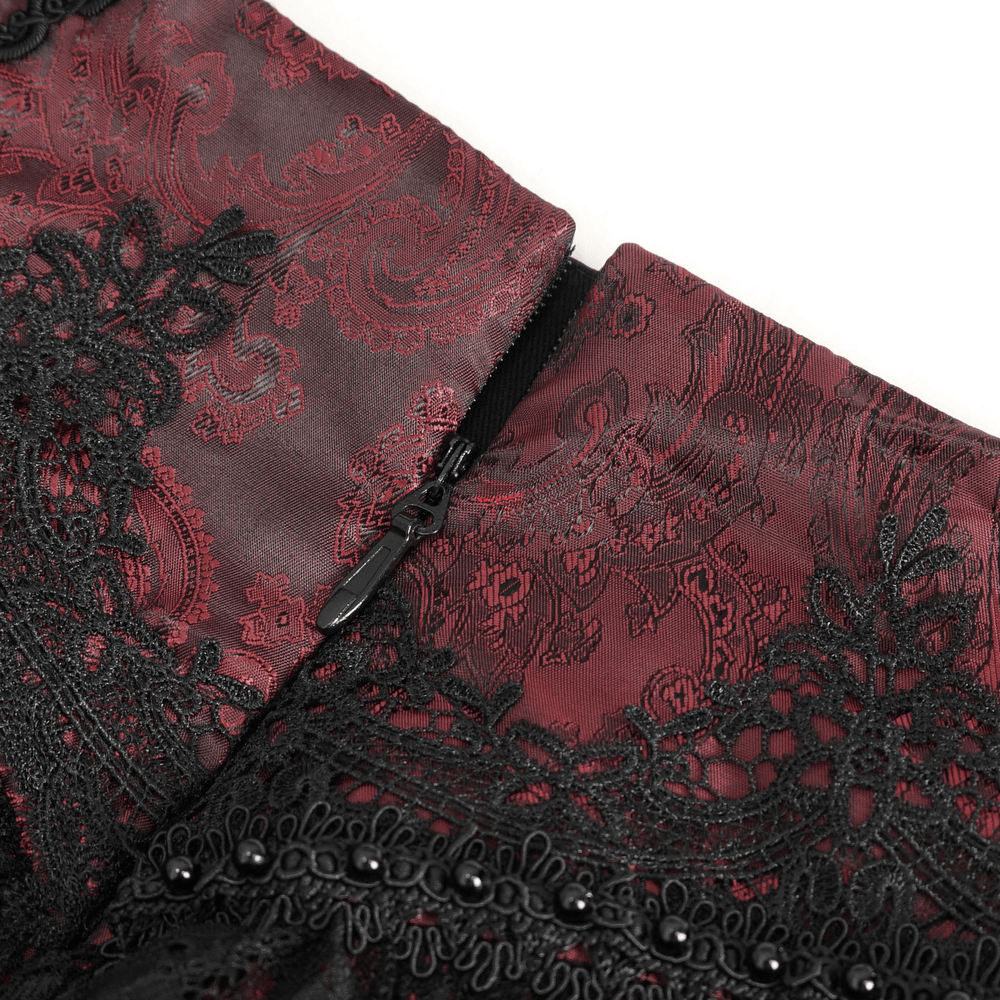 Close-up of the Victorian Gothic lace skirt zipper detail with intricate red and black designs.