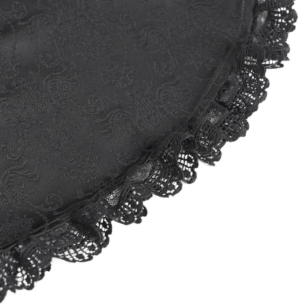 Close-up of black jacquard fabric with intricate lace trim, perfect for a Victorian Gothic blouse.