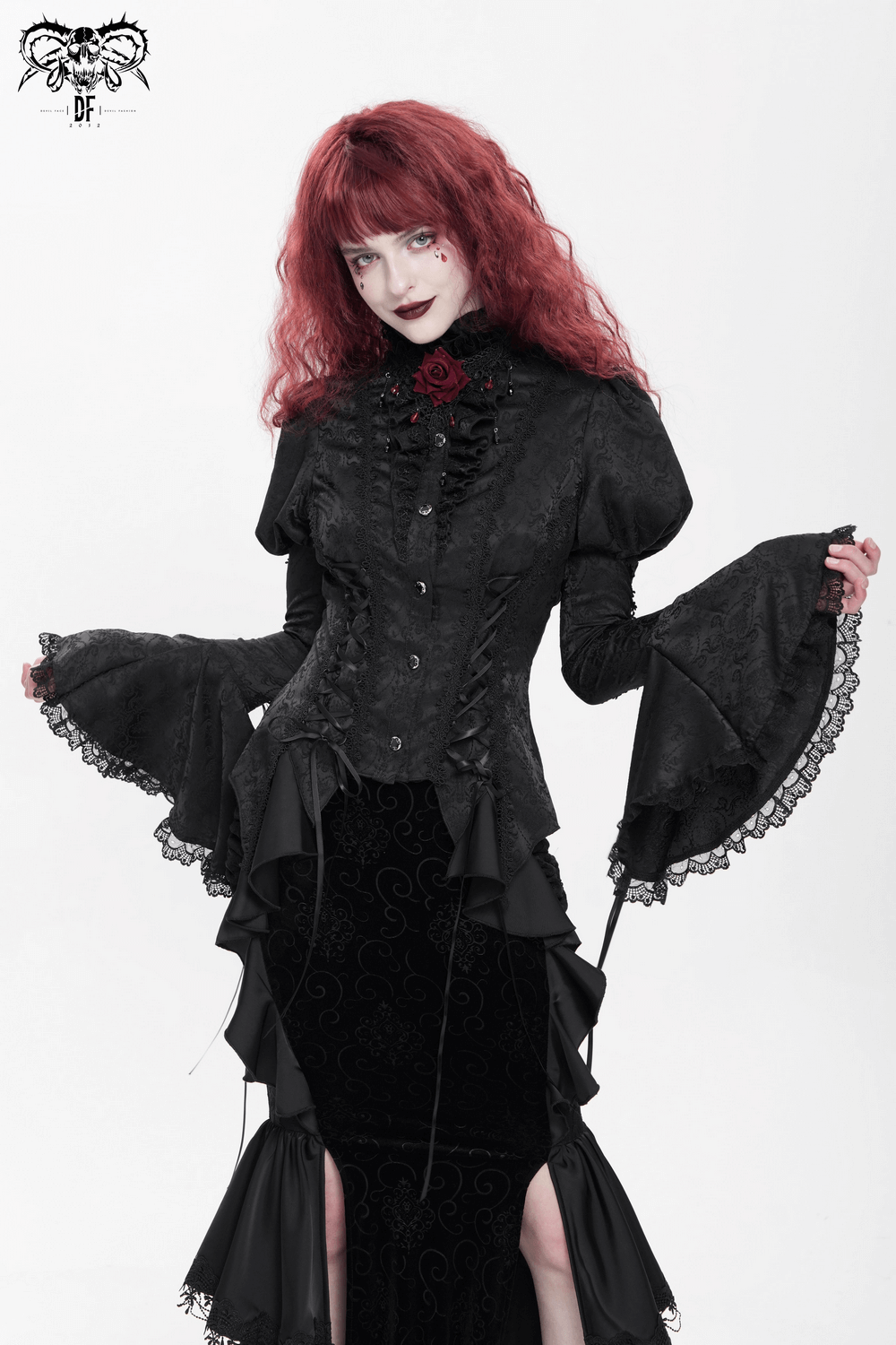 Victorian Gothic blouse with lace-up detail and bell sleeves, perfect for alternative fashion and cosplay.