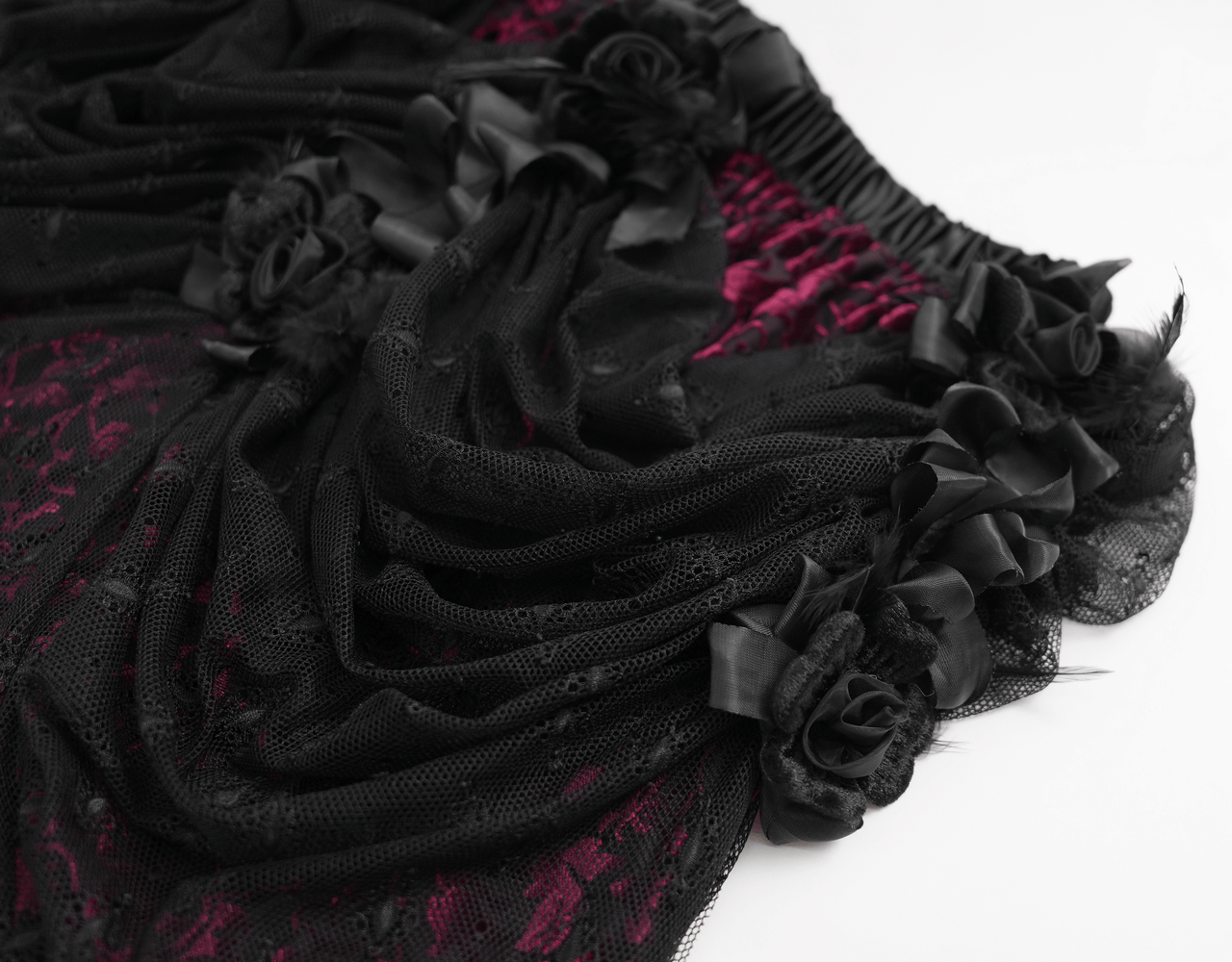 Victorian Gothic layered skirt featuring lace, bead details, and delicate rose embellishments in black and deep red.