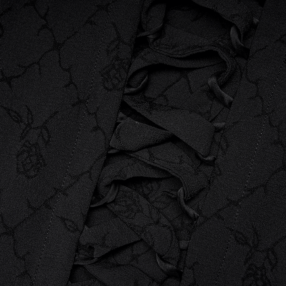 Close-up of Victorian Gothic rose-patterned fabric with delicate lace detail and adjustable ties.