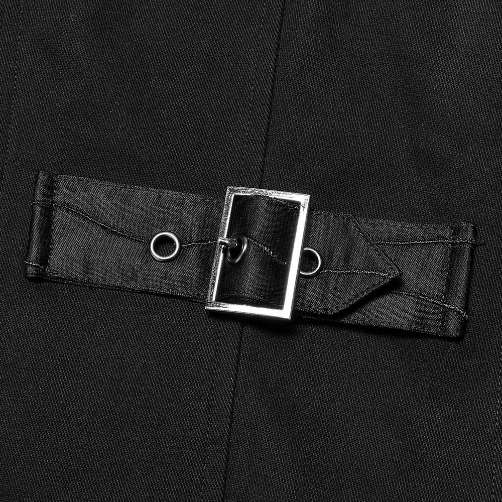 Close-up of a black fabric belt with a shiny silver buckle and loops, adding a stylish accent to a garment.