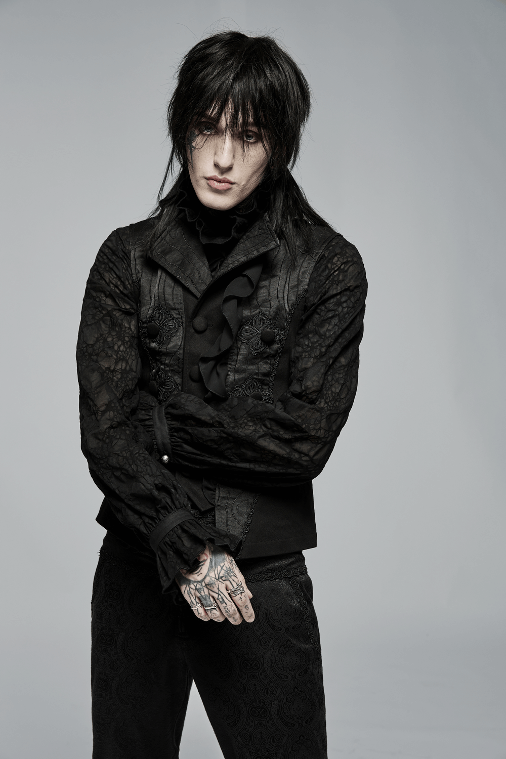 Model showcasing a Victorian Gothic Ruffle-Front Jacquard Vest in black with intricate details and dramatic flair.