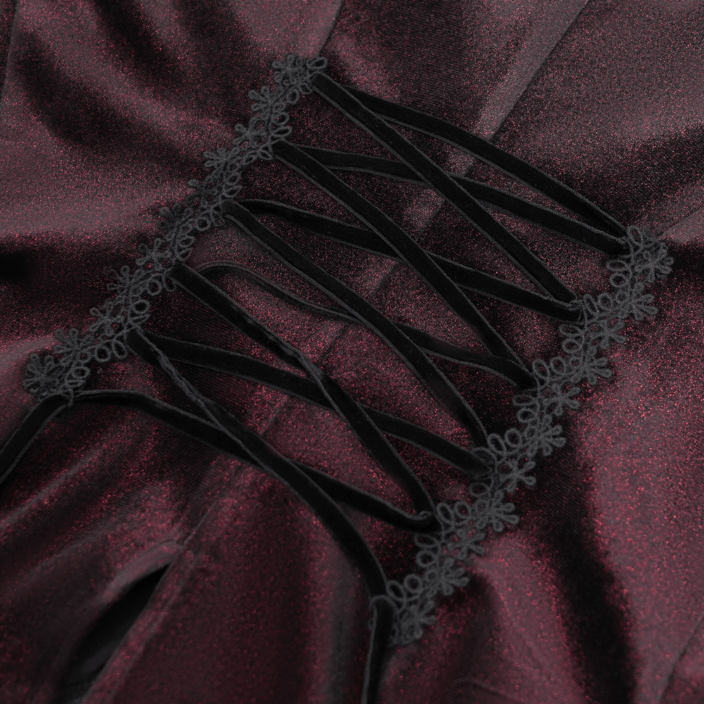 Close-up of velvet blouse lace-up detail, featuring ruffled edges and intricate black lace trim, perfect for gothic fashion.