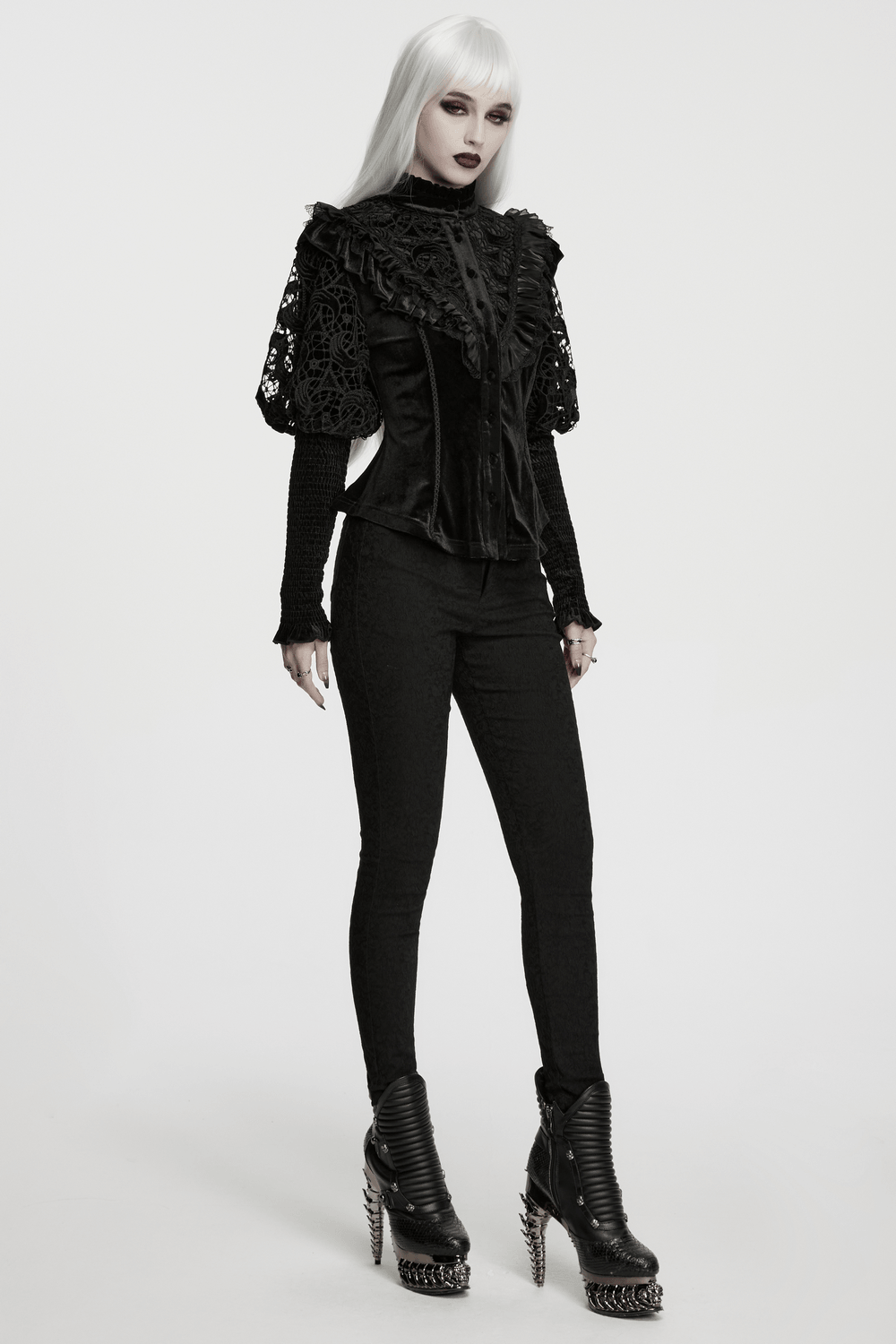Victorian Gothic Velvet Blouse with Lace Puff Sleeves worn by a model with spiked heeled boots.