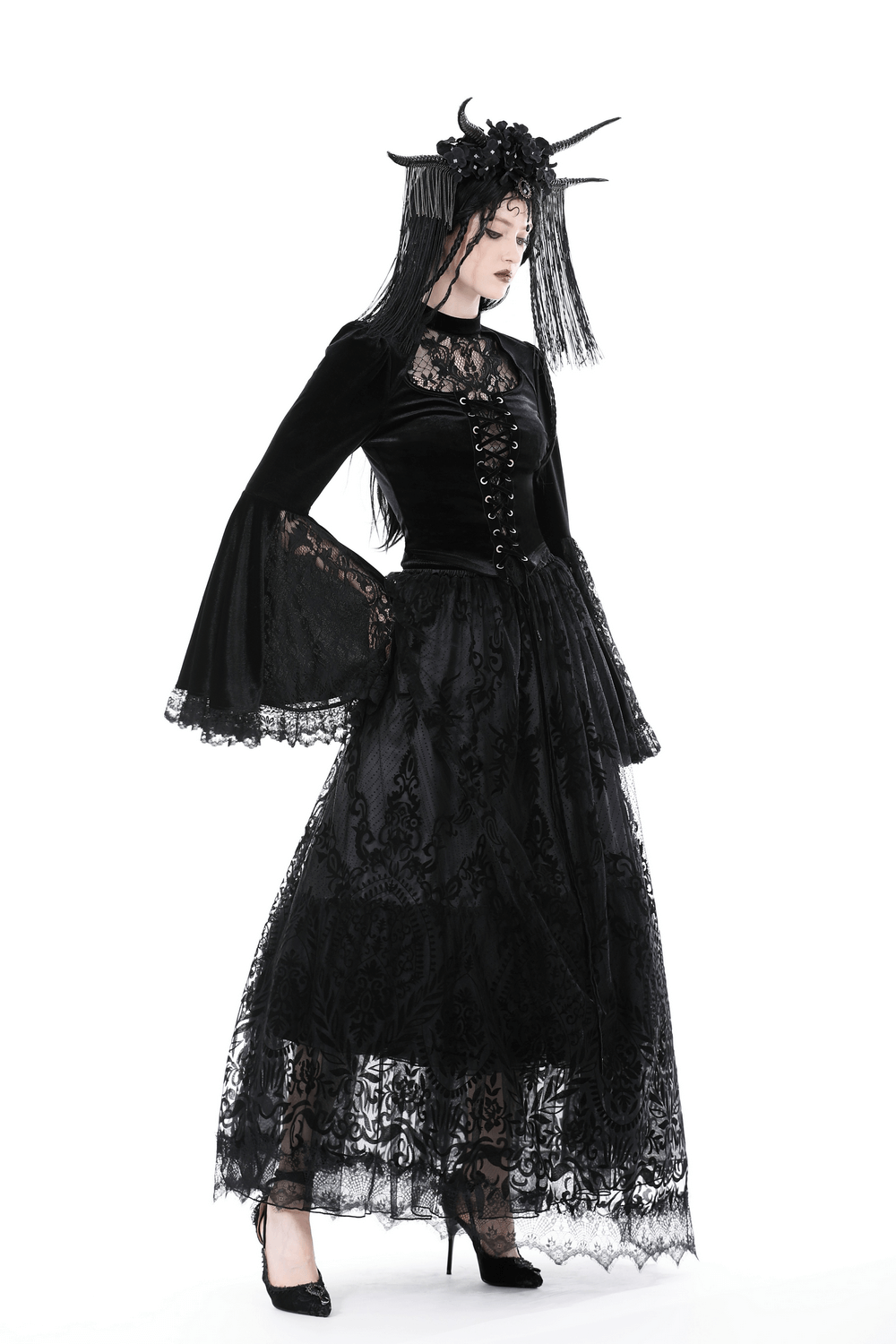 Victorian Gothic black lace and velvet top with bell sleeves, paired with a flowing lace skirt for a romantic look.