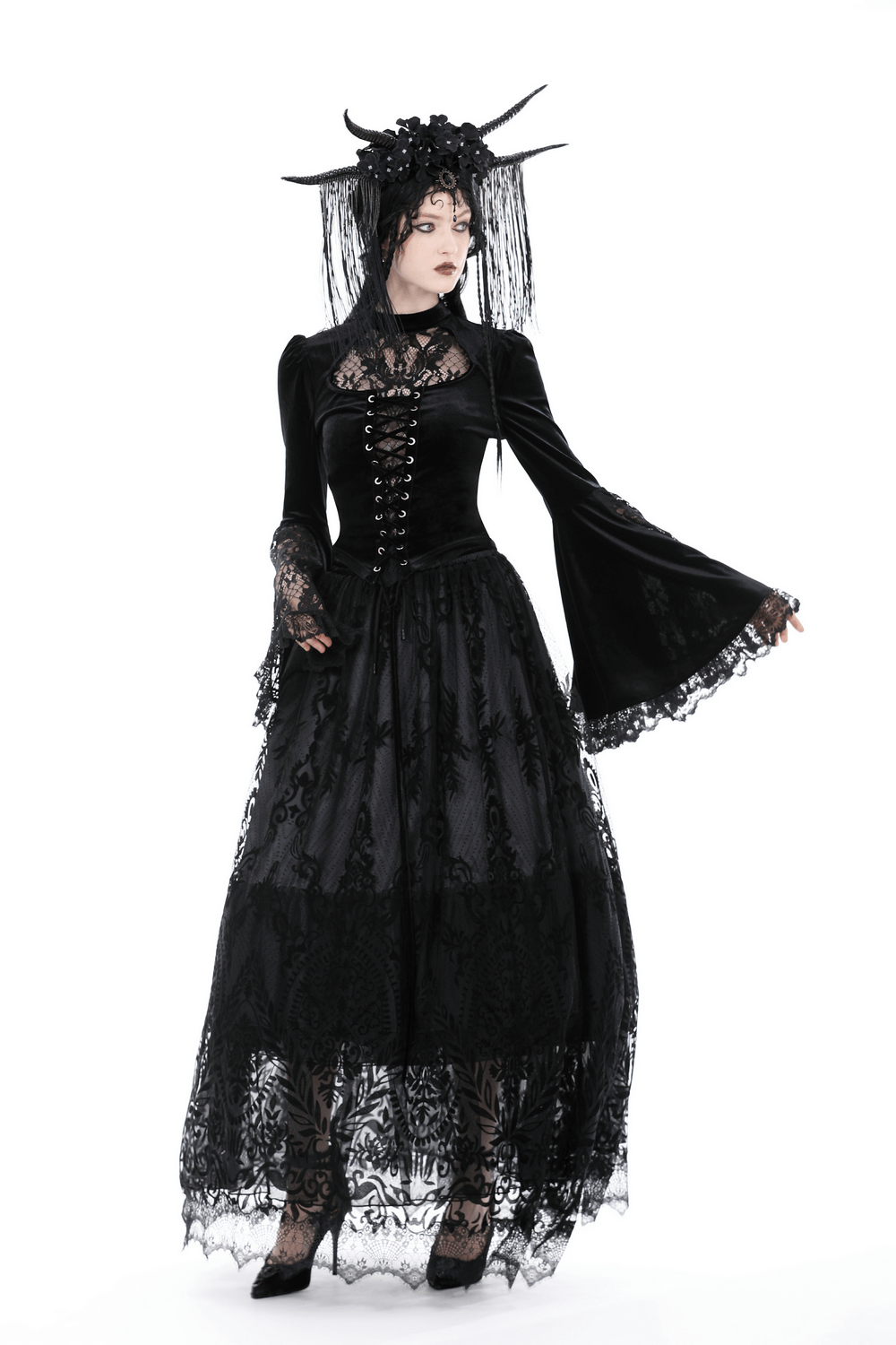 Victorian Gothic black velvet lace top with bell sleeves, paired with a flowing skirt for an enchanting look.