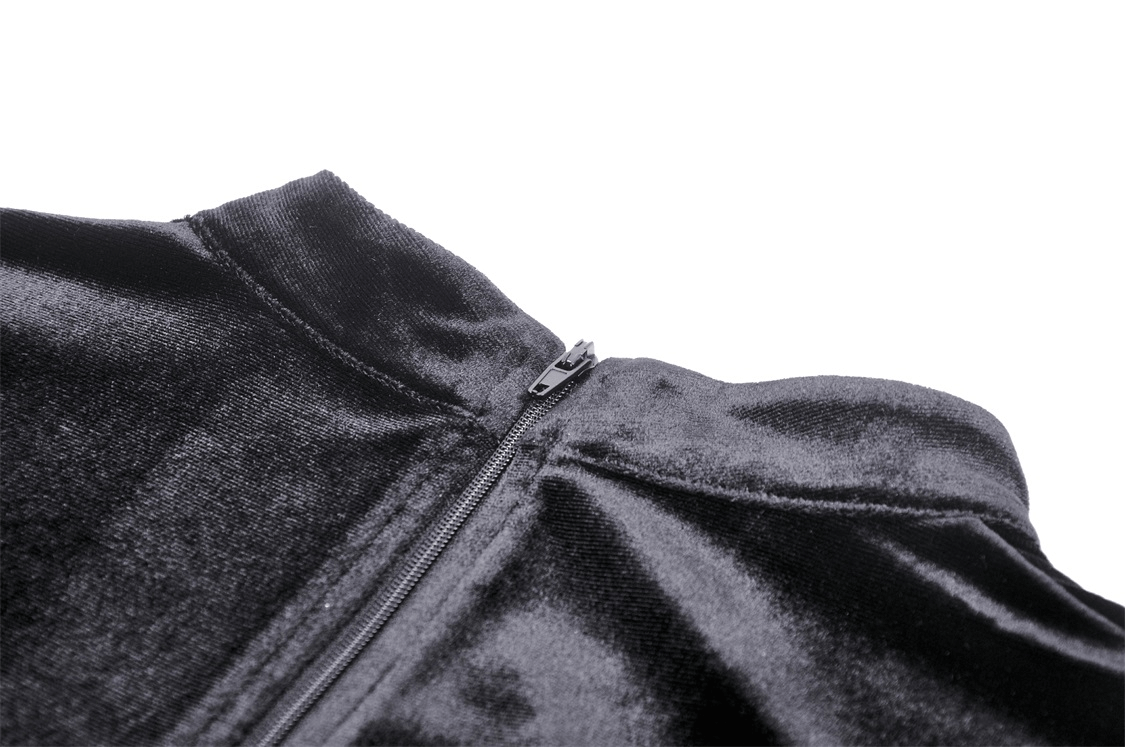 Close-up of black velvet top with zip closure, showcasing its luxurious fabric.