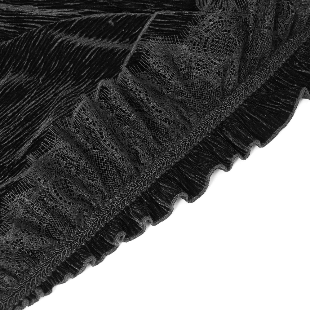 Close-up of black velvet fabric with lace ruffle trim, showcasing gothic elegance and dark romantic style.