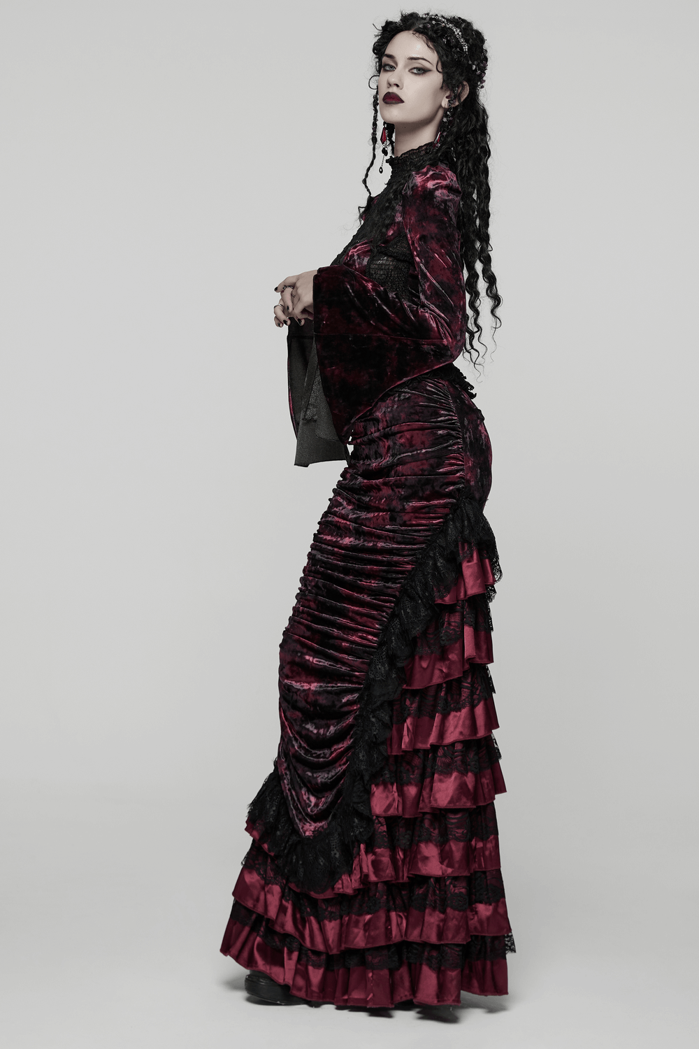 Victorian Gothic Velvet Skirt with Ruffled Lace Hem shown on model, featuring tiered patchwork and dramatic lace hem.