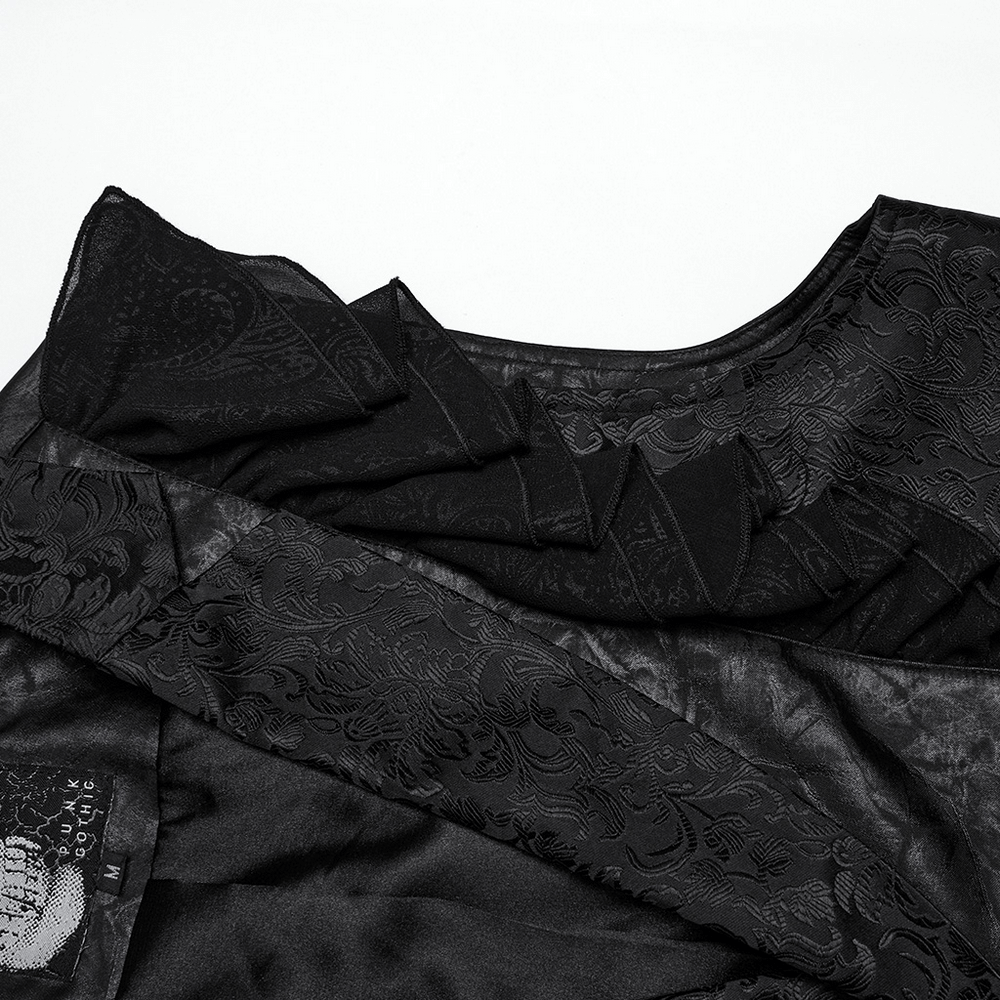 Close-up of Victorian Gothic vest showcasing ruffled jacquard design and elegant black fabric texture.