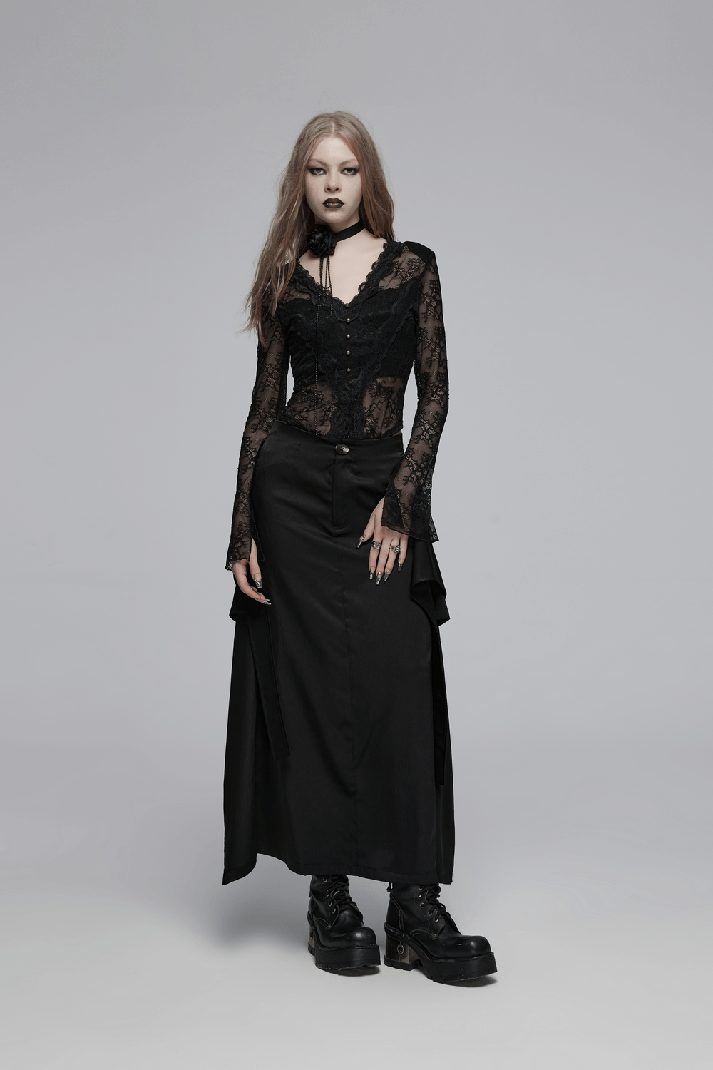 Model wearing a Victorian-inspired black A-line maxi skirt with pockets and a lace top, exuding gothic elegance.