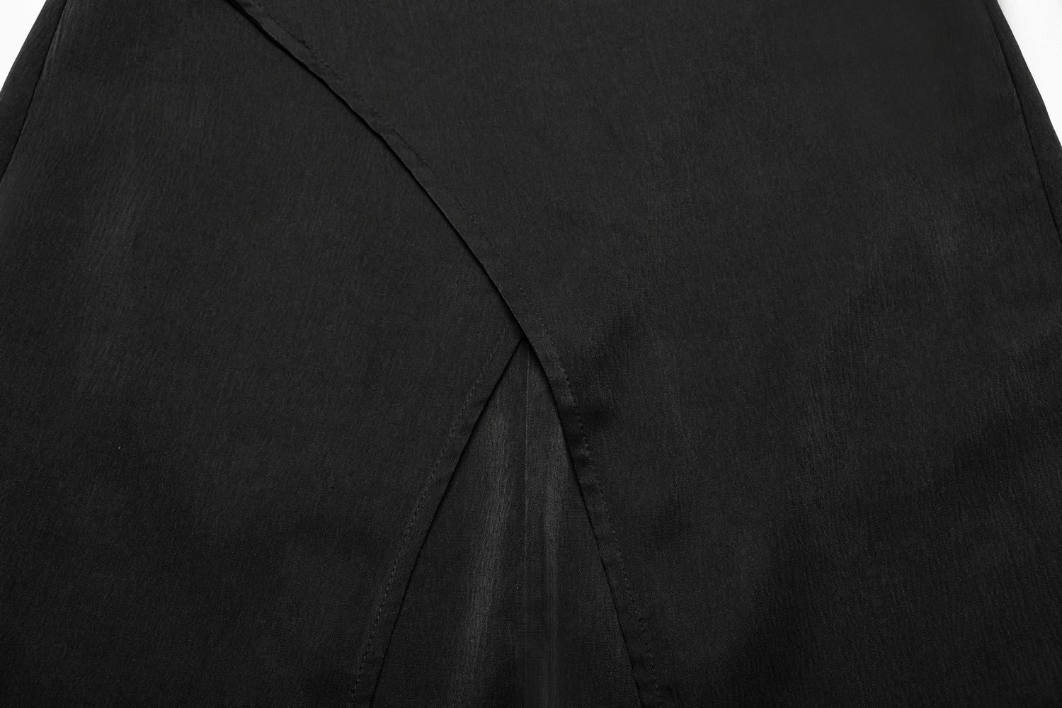 Close-up of a Victorian-inspired black A-line maxi skirt with elegant rear slit detail.