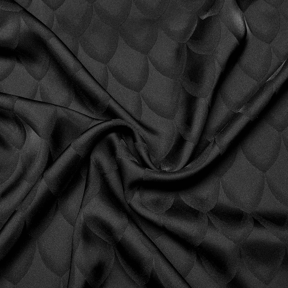 Luxurious black jacquard fabric with a dragon scale pattern, perfect for elegant Victorian-inspired designs.