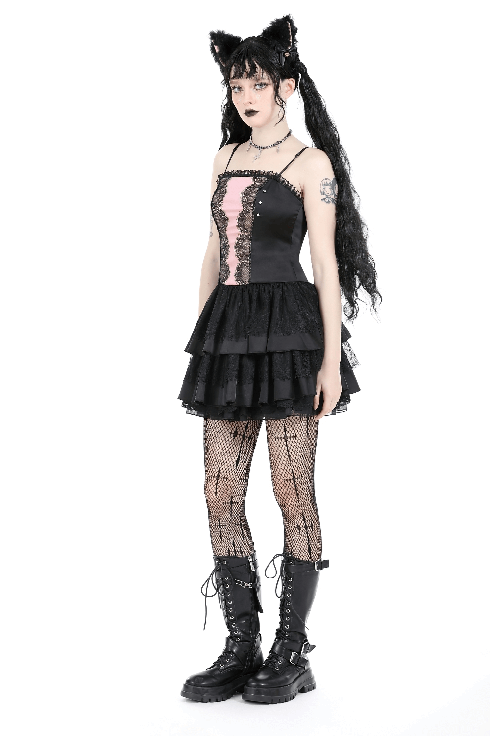 Victorian-inspired black pink lace layered mini dress with ruffles, styled with fishnet tights and cat ears.