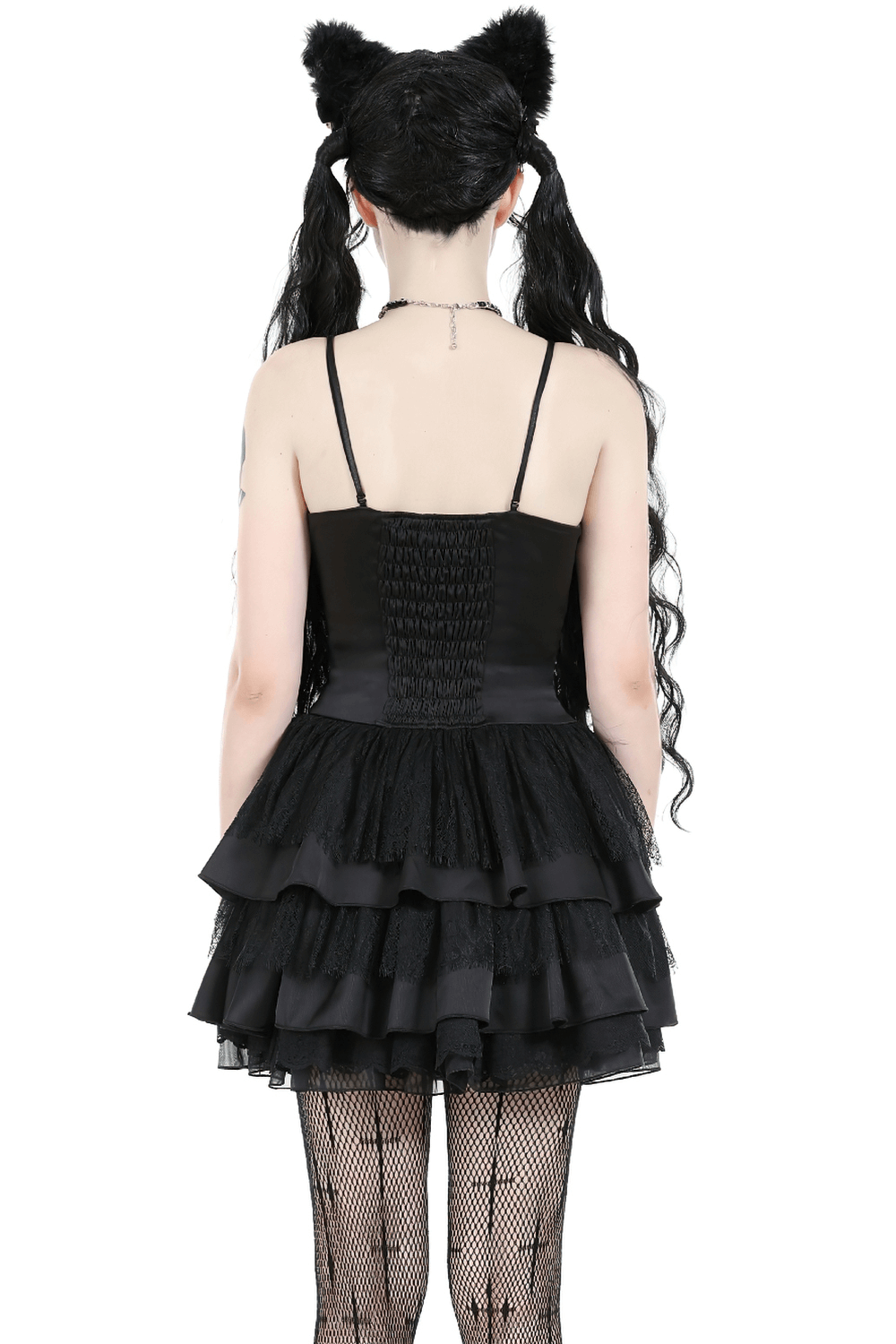 Back view of a Victorian-inspired black lace mini dress with ruffles, showcasing gothic elegance.
