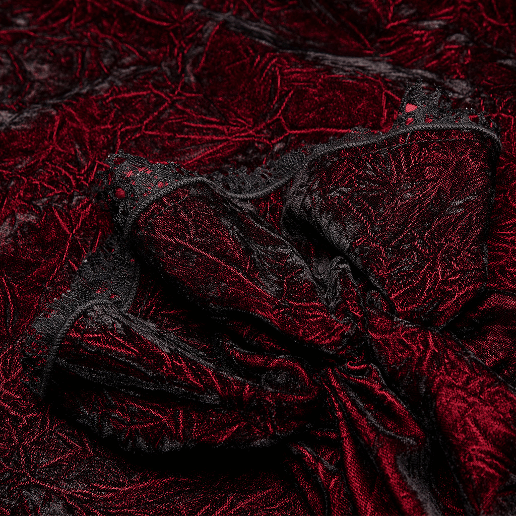 Close-up of rich burgundy crimped velvet fabric showcasing a textured, gothic aesthetic for Victorian-inspired fashion.