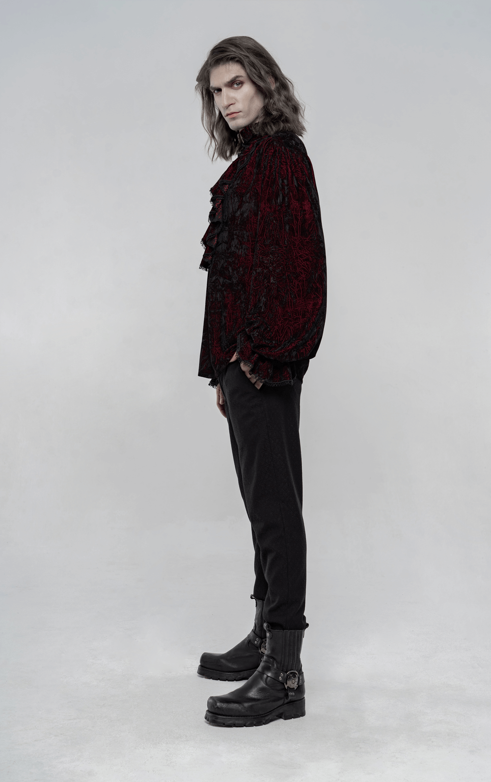Victorian inspired crimped velvet gothic shirt for men, featuring ruffled design and stylish black boots.