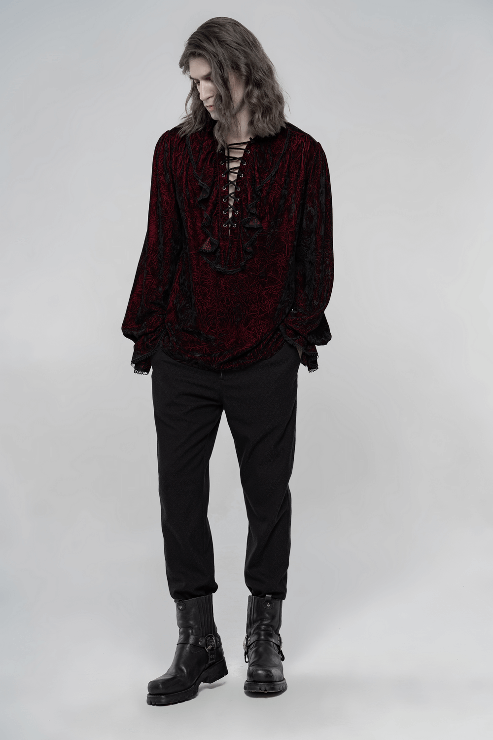 Victorian inspired crimped velvet gothic shirt for men in deep red, styled with black trousers and combat boots.