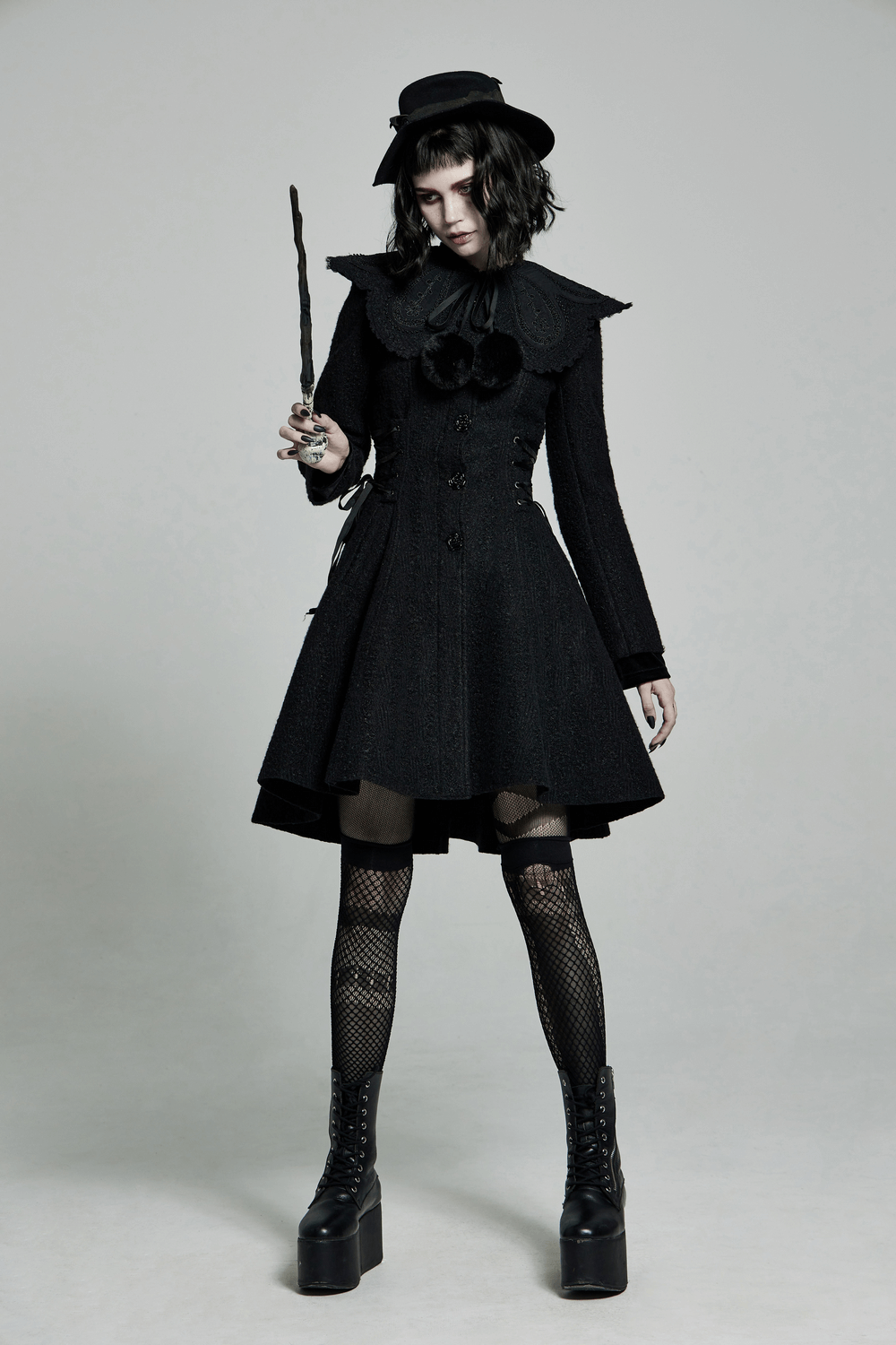 Victorian-inspired goth outfit with detachable collar, fishnet stockings, and platform boots, showcasing elegance and whimsy.