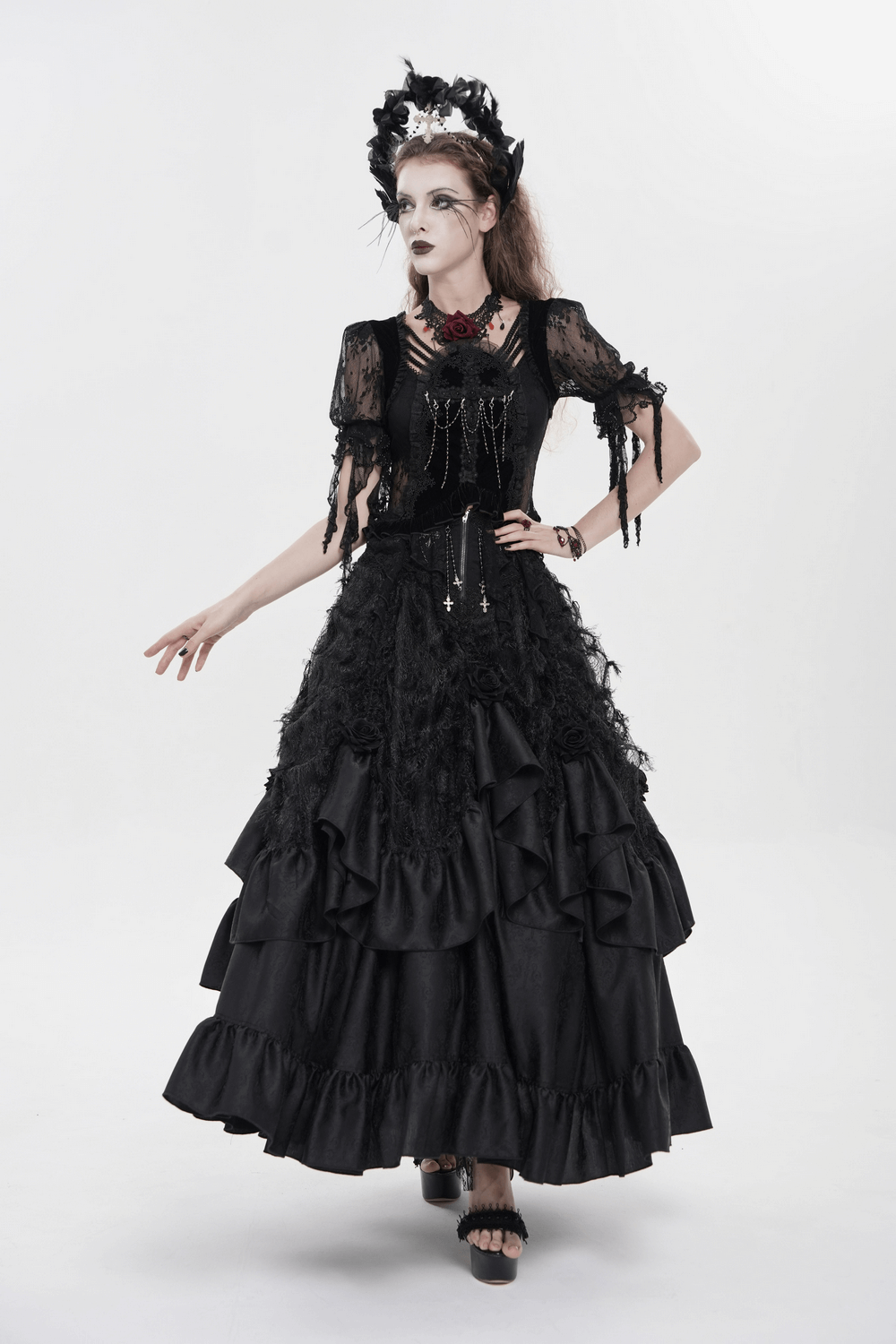 Victorian-Inspired Gothic Ruffle Skirt with Cross Details worn by model, showcasing layered satin ruffles and cross embellishments.