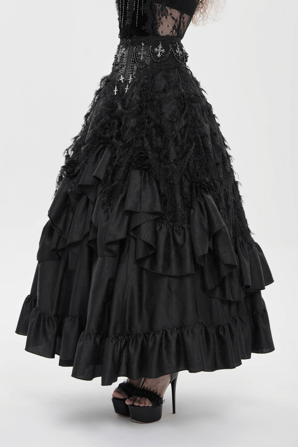 Victorian-Inspired Gothic Ruffle Skirt with Cross Details showcasing layered satin ruffles and silver cross embellishments.