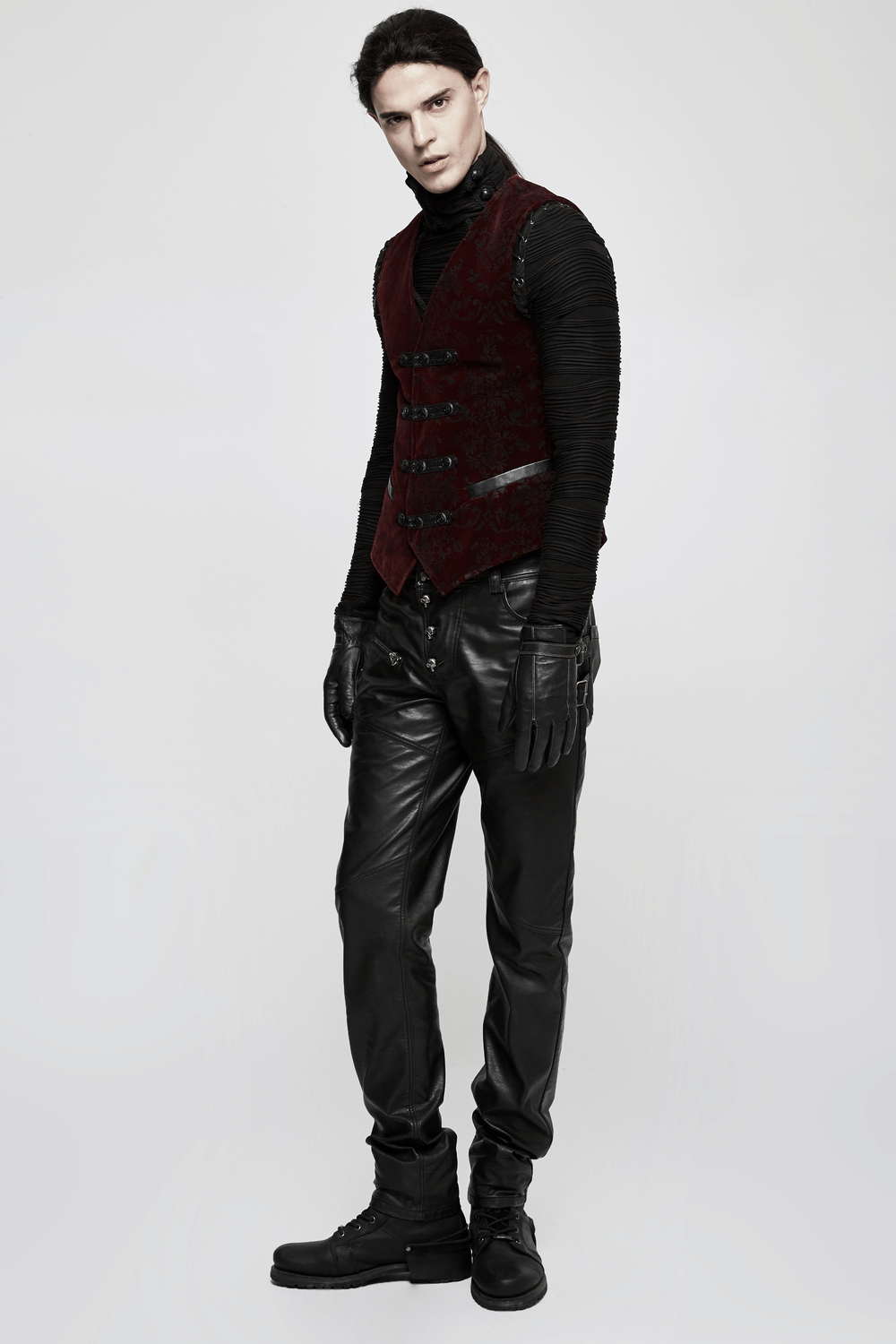 Victorian-inspired velveteen waistcoat paired with sleek black leather pants, embodying gothic elegance and style.