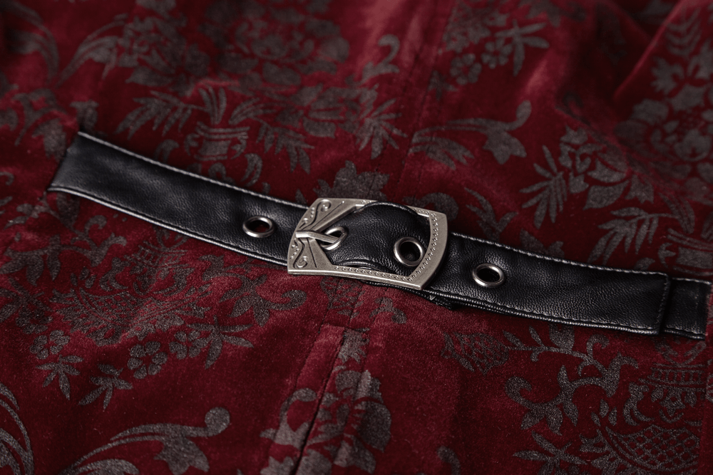 Close-up of a Victorian-inspired velveteen waistcoat belt with detailed metal buckle and rich burgundy fabric.