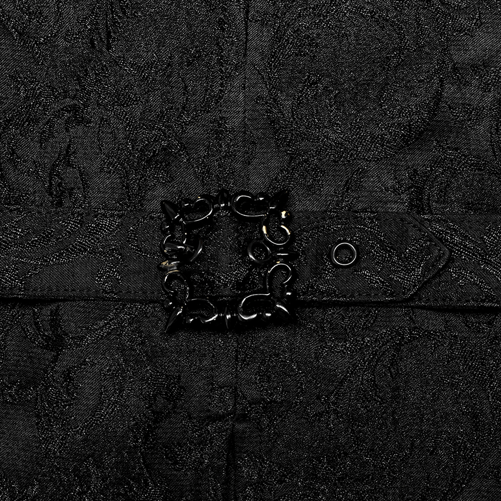 Close-up of a Victorian-inspired black jacquard vest featuring intricate hand-sewn button detail.