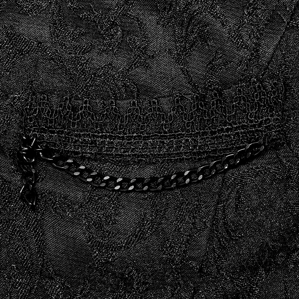 Close-up of the jacquard fabric texture with intricate black pattern and stylish zipper detail for goth vest.