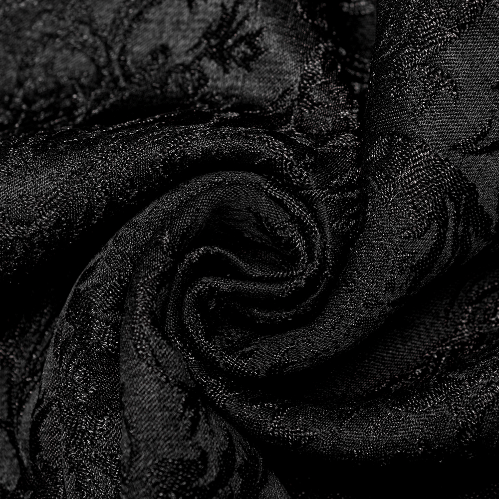 Close-up of elegant black jacquard fabric featuring a stunning 3D pattern, ideal for Gothic-inspired fashion.
