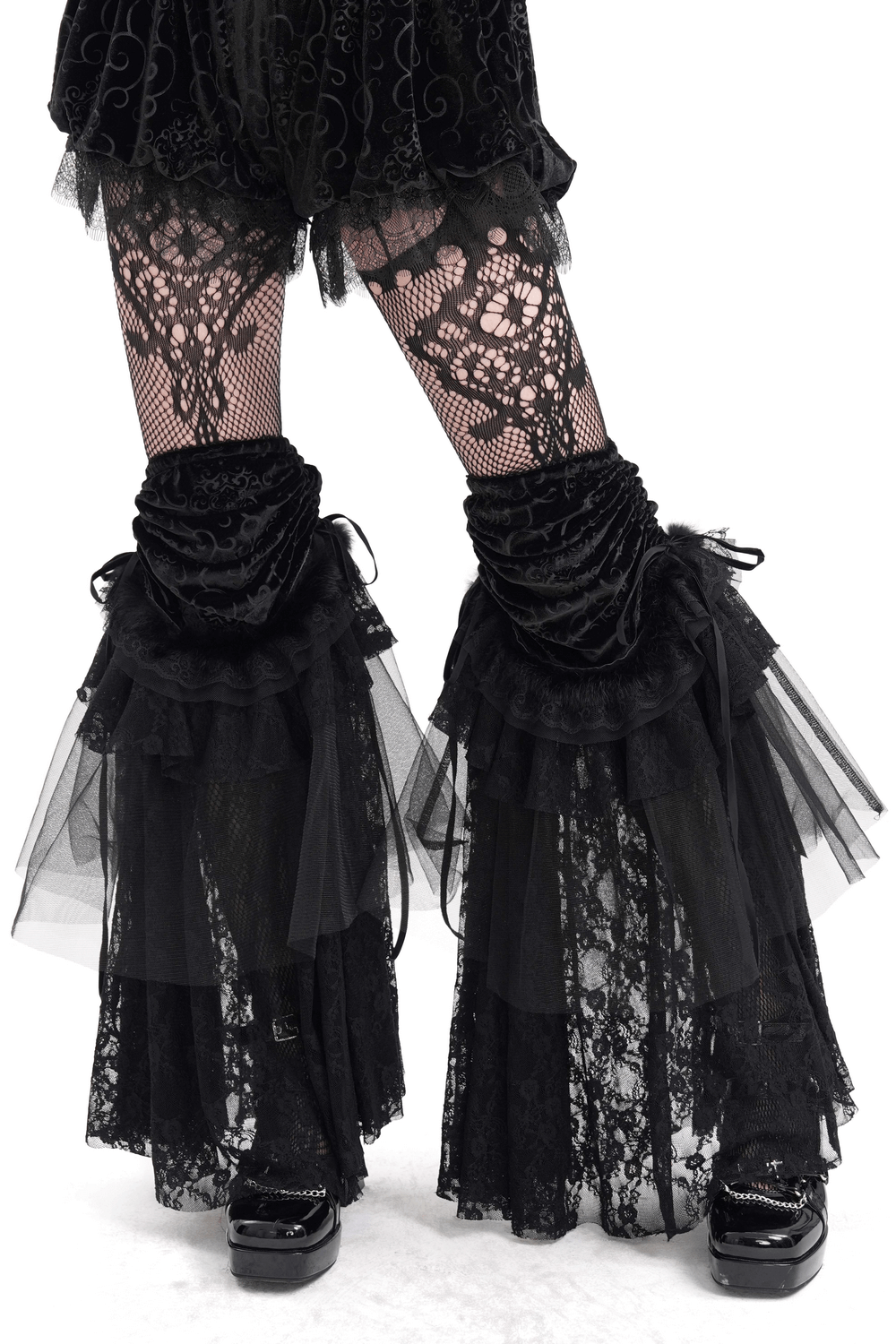 Victorian-inspired lace and velvet leg warmers with tulle layers for a gothic look, perfect for skirts and dresses.