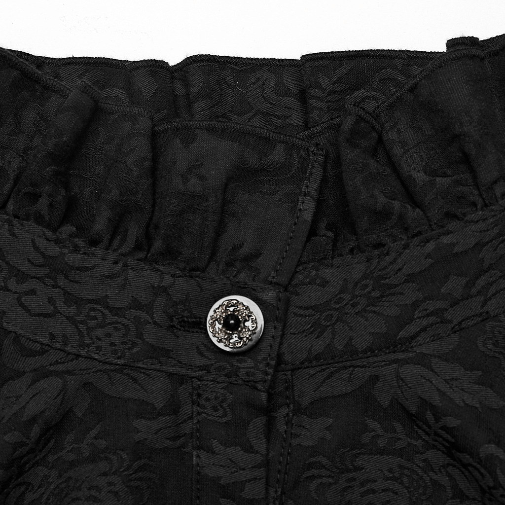 Close-up of the ruffled collar and ornate button of a Victorian-inspired black lace goth blouse.